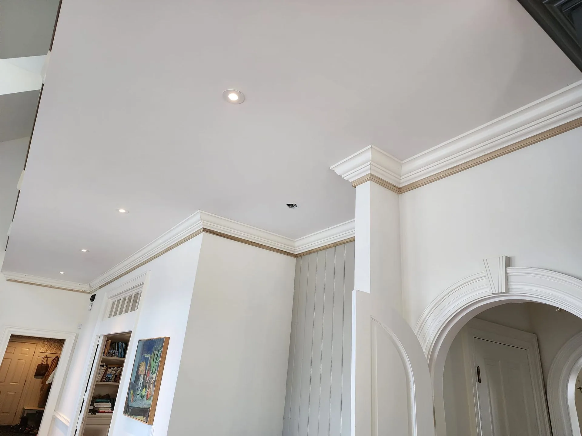 Elegant crown molding and arched doorway trim work